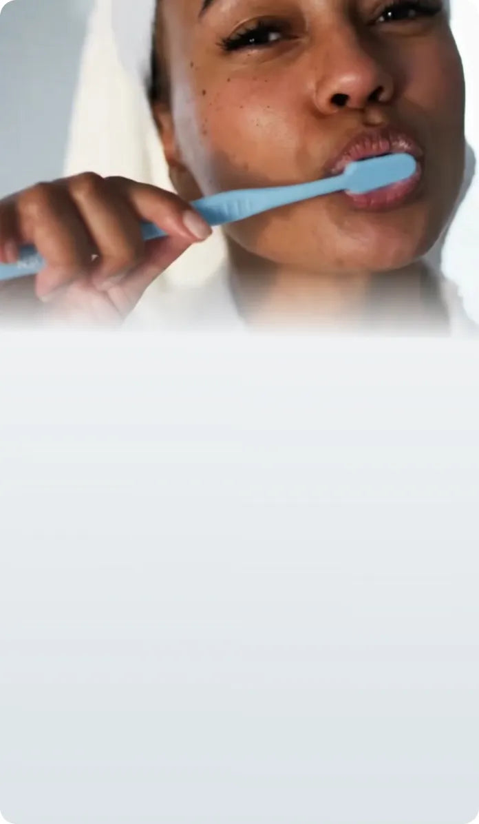 Woman brushing her teeth