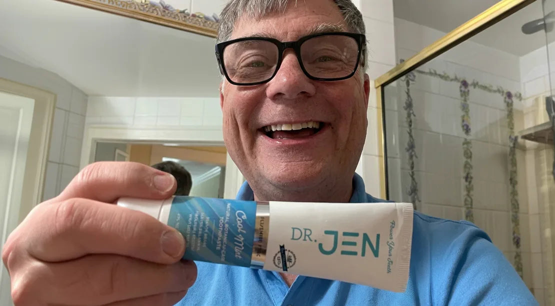 Customer holding Dr. Jen's toothpaste