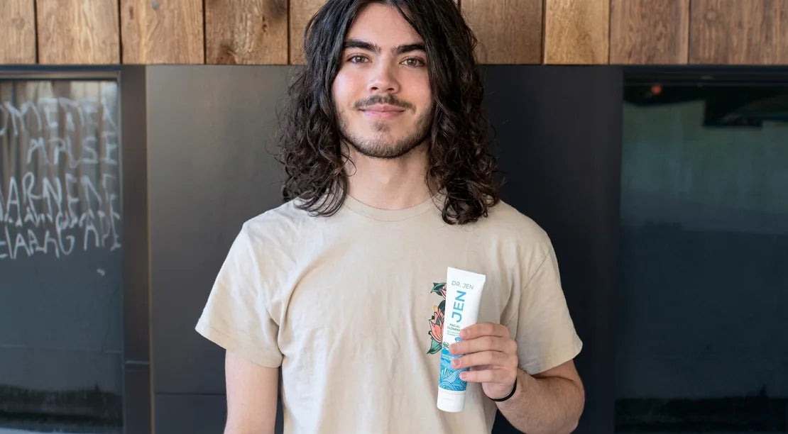 Customer holding Dr. Jen's toothpaste